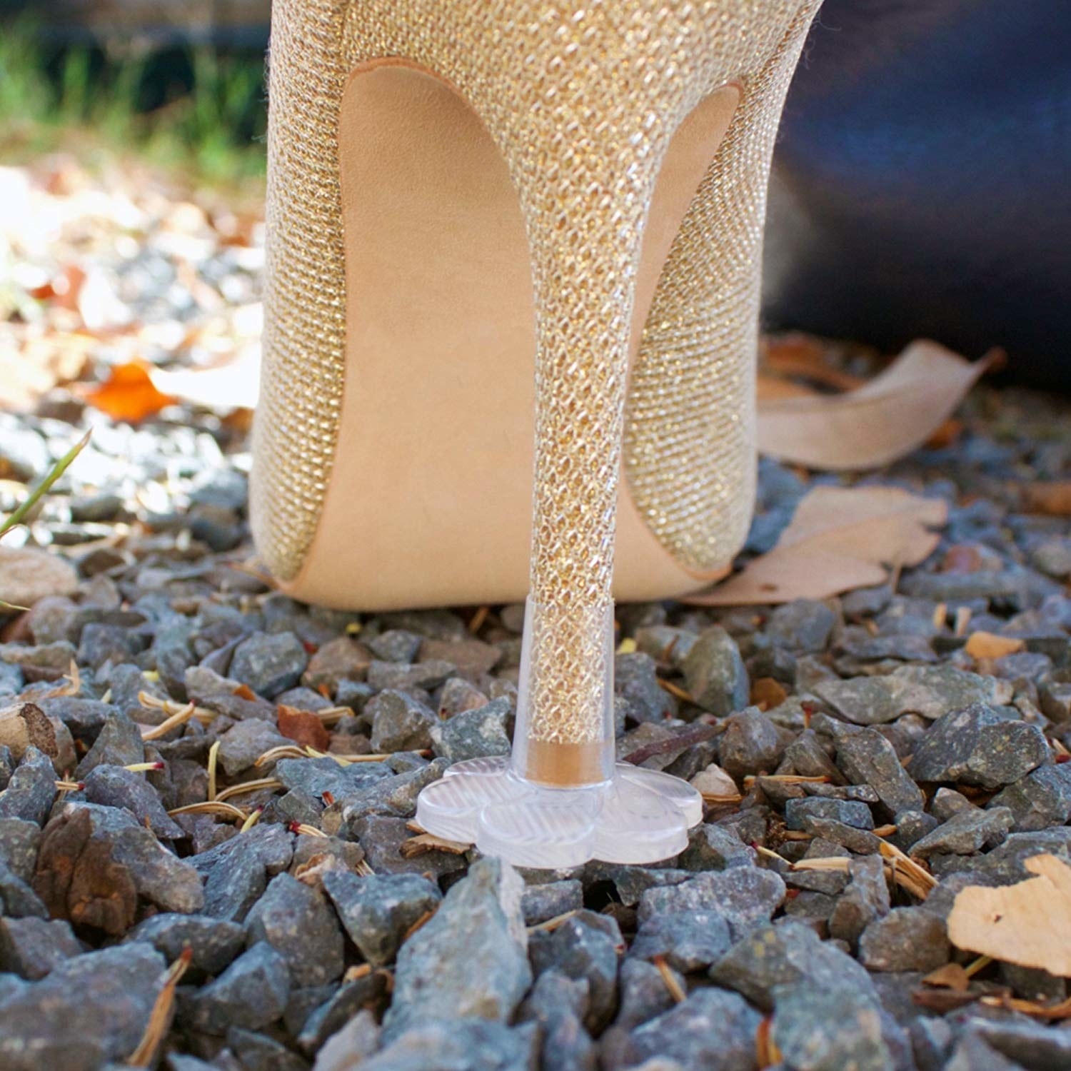 high heel with clear flower-shaped plastic cap on the end