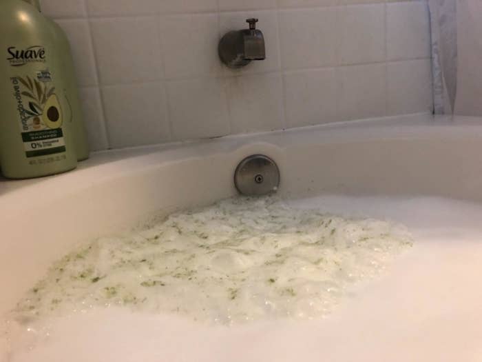 dirty green foam in tub