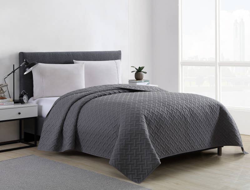 Promising review: "I love this quilt! It is just the right weight to keep us warm without feeling too hot and it is soft and comfortable. It washes and dries very easily. Our two basset hounds sleep on our bed with us; they shed and drool, so I wash the quilt every week. The dark gray is a true gray." —notawahooPrice: .99+ (available in two sizes)