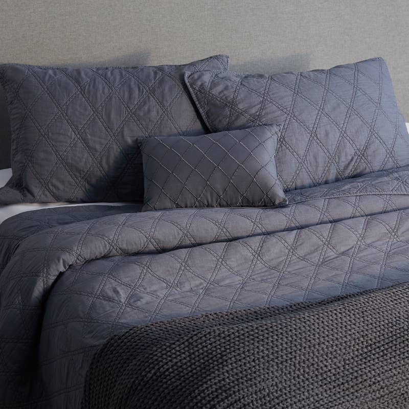 Includes a quilt, two shams, and two decorative pillows. Price: .99+ (available in two colors and three sizes)