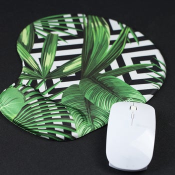 product photo showing mouse pad with palm leaves 