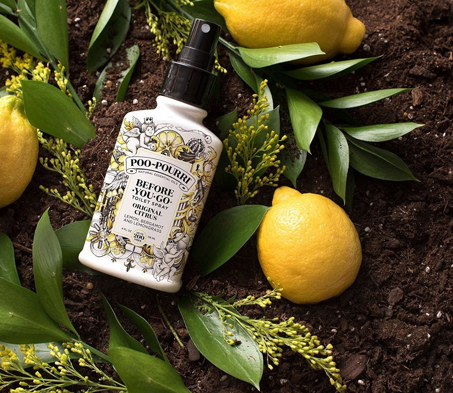 A bottle of the original citrus-scented spray styled with lemons and lemon branches