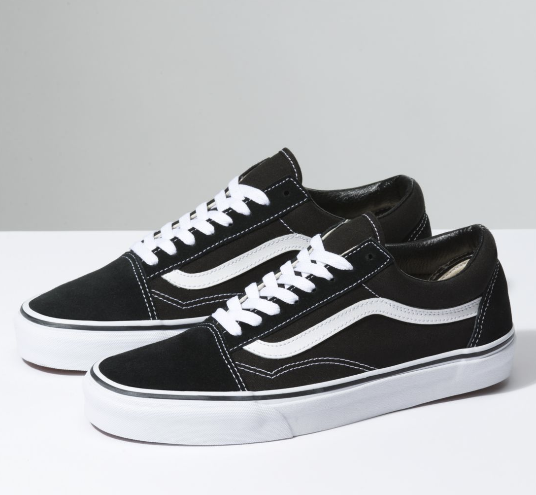 The shoes in black with a thick white sole, white laces and stitching, and a white curves line down the side