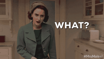 Gif of Rachel Brosnahan in the TV show &quot;The Marvelous Mrs. Maisel&quot; looking down and saying &quot;What&quot;