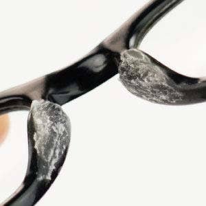 the waxy substance on the nose bridge of glasses