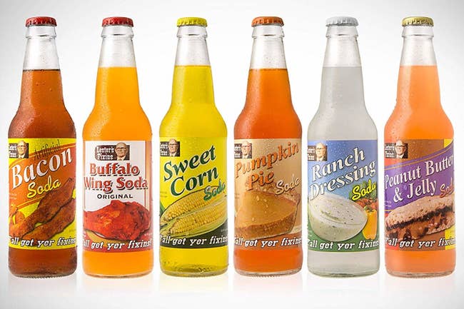 lineup of bottles with sodas that taste like bacon, buffalo wing, sweet corn, pumpkin pie, ranch dressing, and peanut butter and jelly