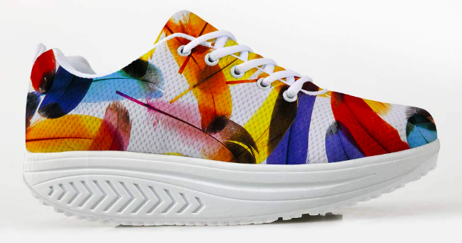 Sneakers with a thick, rounded sole in white and a multi-colored floral pattern on the mesh fabric