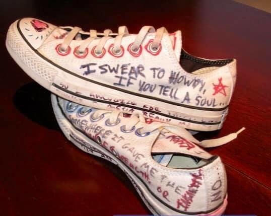 converse with writing all over them