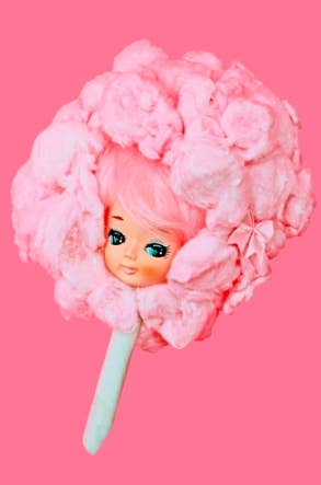 hot pink photo of doll head inside cotton candy ball 