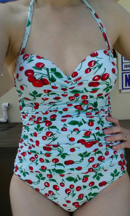 another reviewer in the bathing suit with a white base and cherry print on it