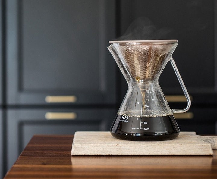 glass pour over coffeemaker being used with the stainless steel coffee filter 