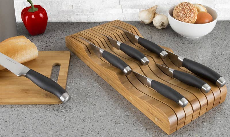 The organizer can hold up to 15 knives.
Promising review: "This knife organizer is a great alternative to knife blocks. It fits in a drawer and holds 15 knives — small ones toward the front and large ones toward the back. I love it because I can put various knives in the block without displaying odd knives on the countertop. It also protects the hands when digging the knives out of a drawer. The knife organizer is high quality — should last forever!" —MEPRE
Price: .16