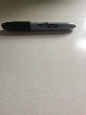 reviewer photo showing sharpie stains completely gone from countertop