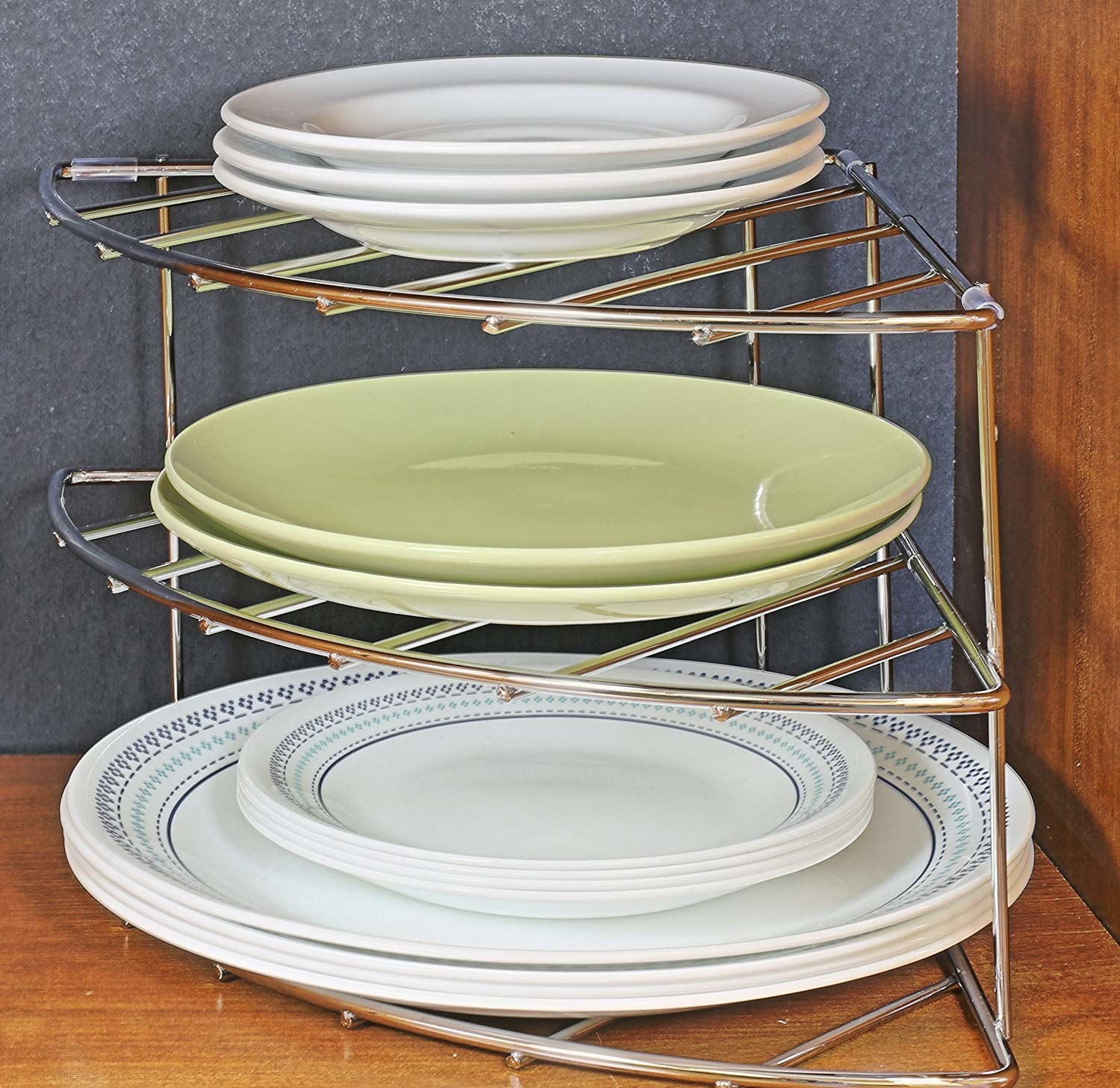 Three-tier silver metal organizer with different sized plates on each shelf