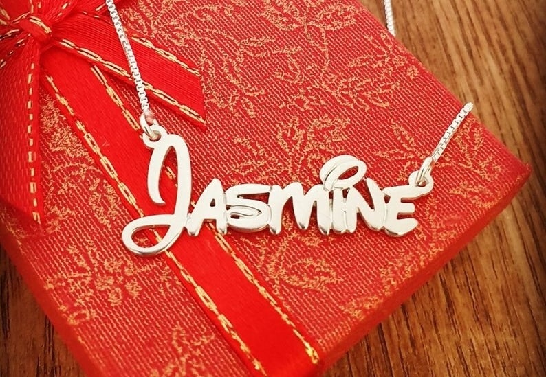 a gold necklace that says &quot;jasmine&quot; in Disney script
