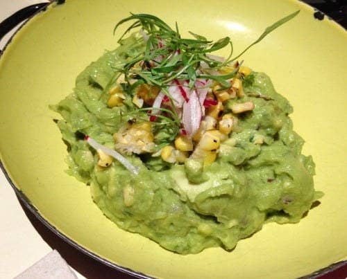 To start, the Guacamole is the perfect appetizer to share. The guacamole at Tijuana Picnic is choke full of chunky avocado mixed with habanero, charred corn, and cilantro. It is topped with julienne radish and micro greens, and served with crunchy blue organic tortilla chips.