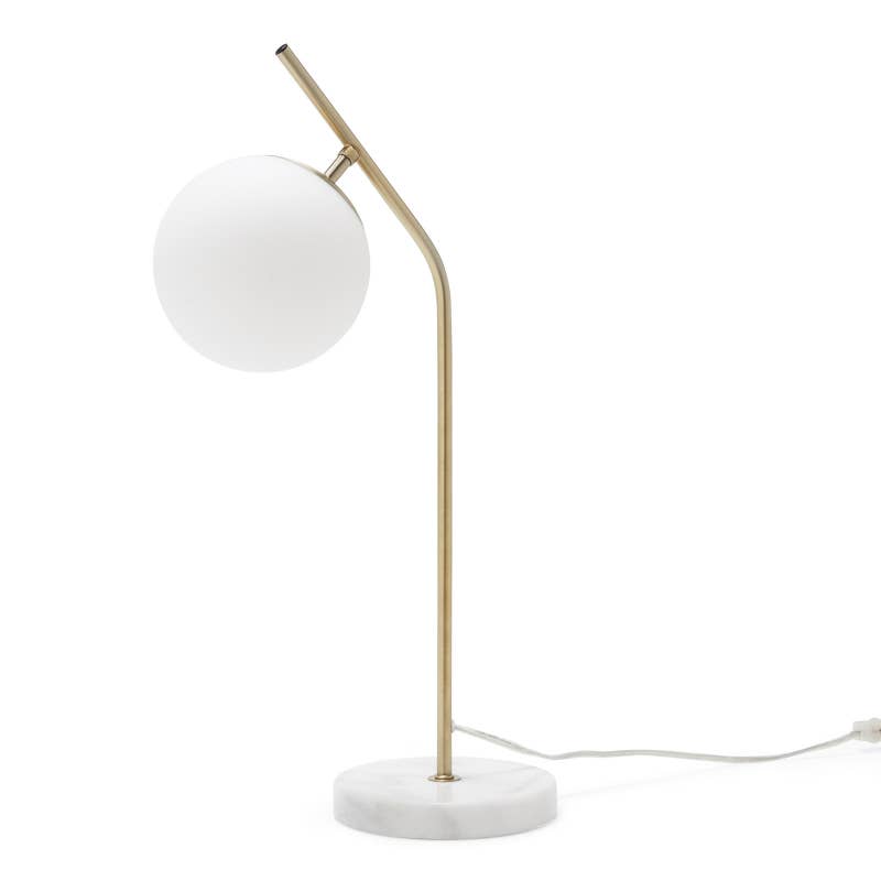 Promising review: "Beautiful marble, perfect shade of brass, and the globe is glass unlike the plastic I've seen on similar lamps. The lamp has weight and is not cheaply put together." —Emily0630Price: