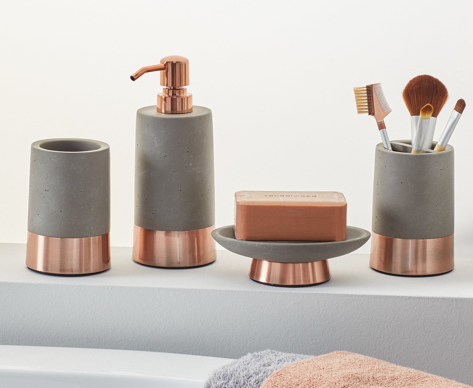 Promising review: &quot;Each piece has good weight and is well-made. The concrete is super smooth. They look great in my bathroom.&quot; —HeatherPrice: 