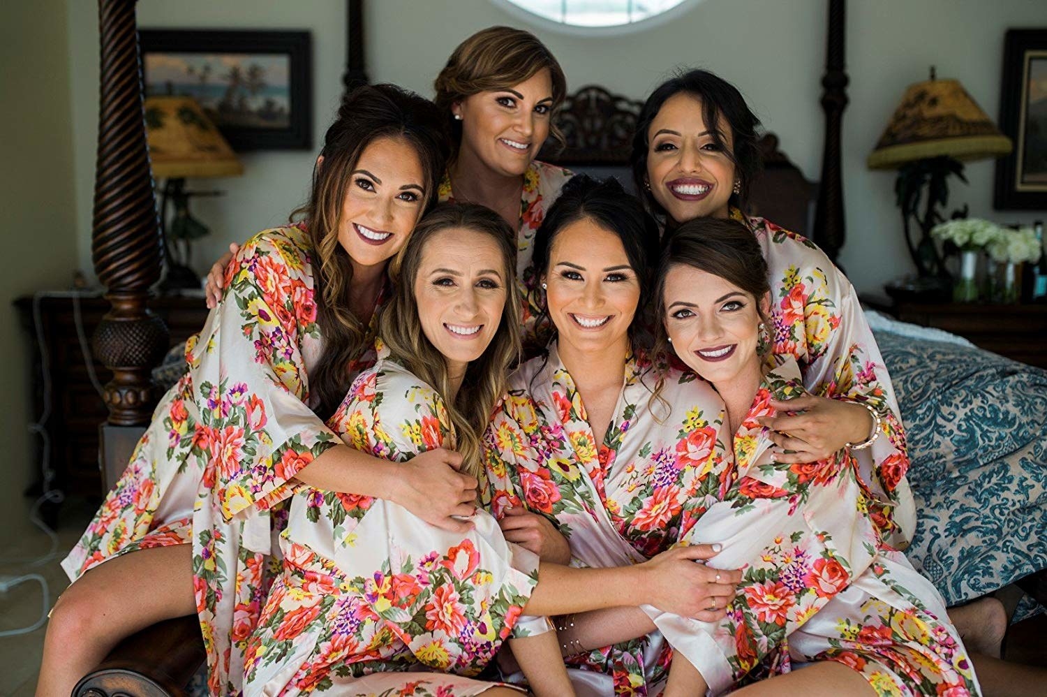 An image of six people wearing the robe in a matching floral print 