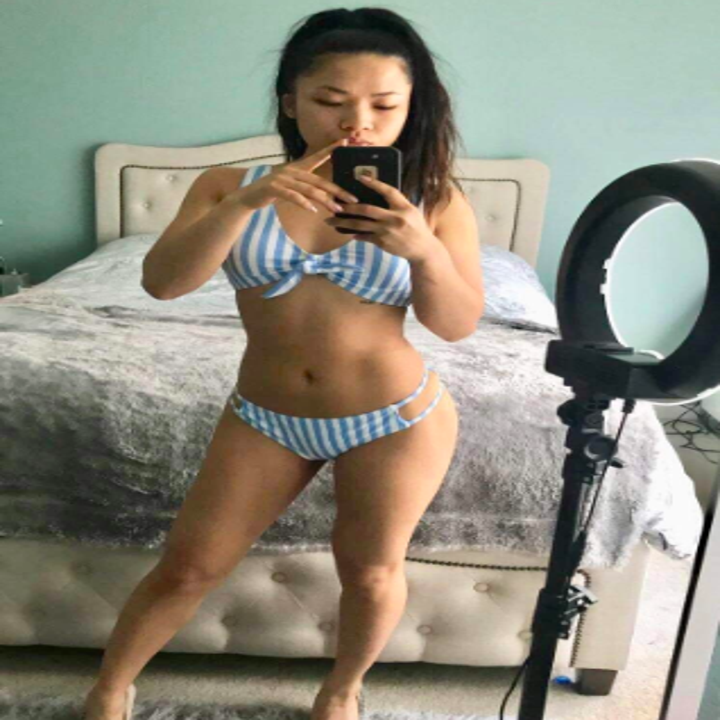 Reviewer wearing the bikini in light blue and white wide stripe
