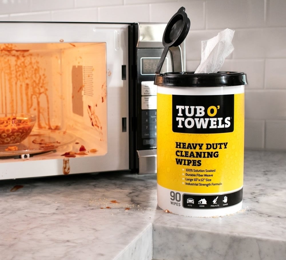 the heavy-duty wipes in front of a dirty microwave 