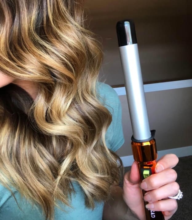 Reviewer side profile showing the loose waves made with the Bed Head curling wand