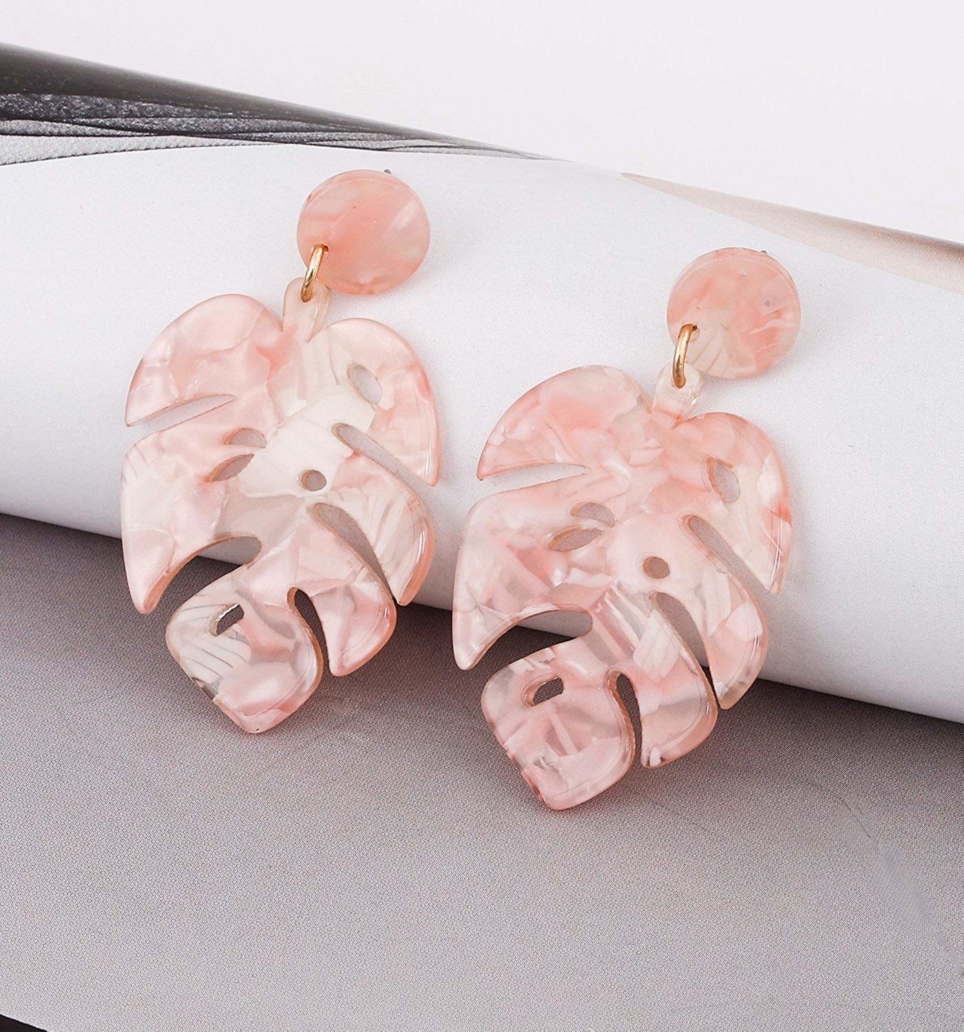 The pink earrings