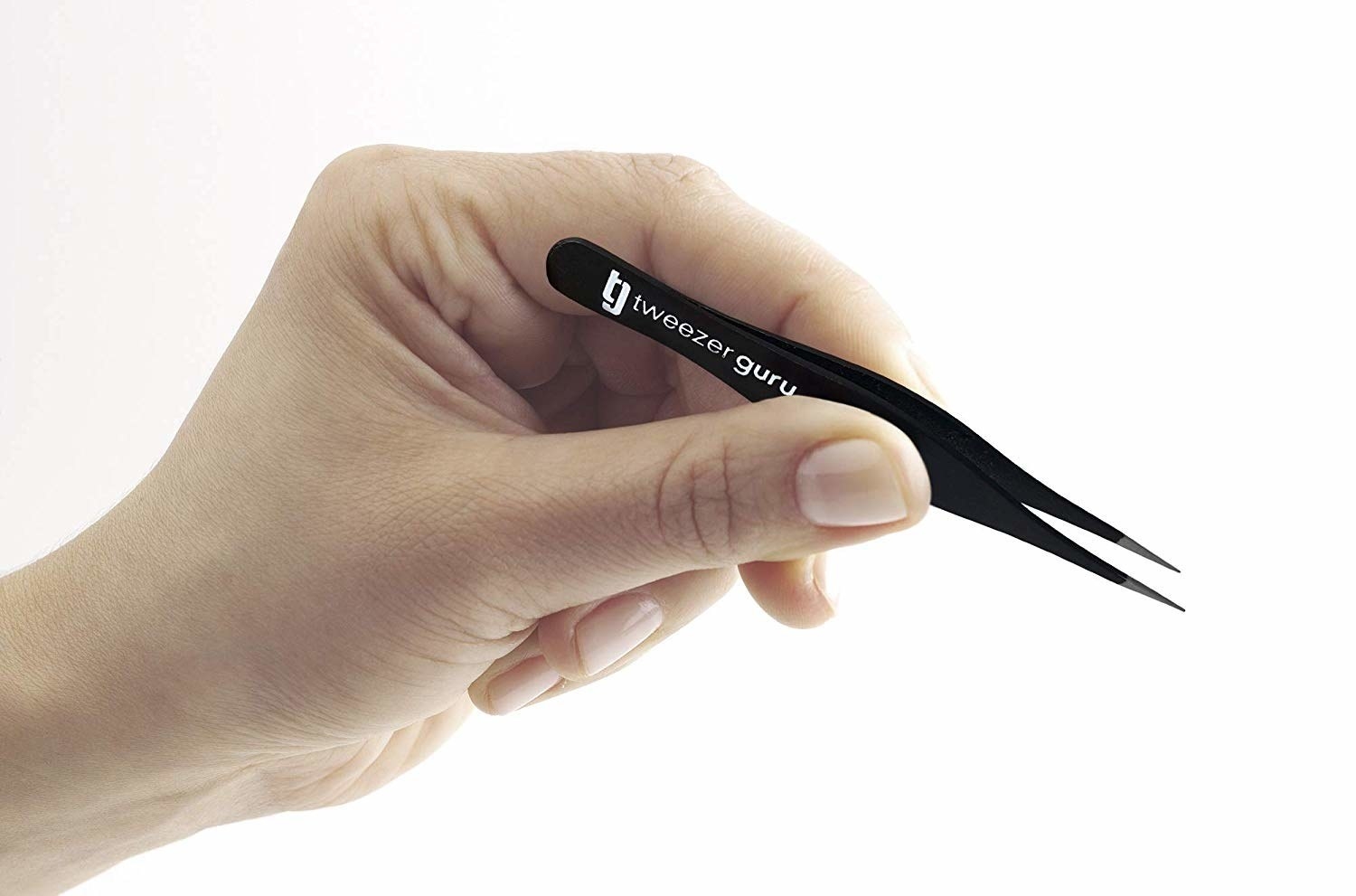 Model holding the tweezers with a super fine point