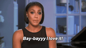 Gif of a person saying, &quot;Bay-bayy I love it&quot; and snapping their fingers