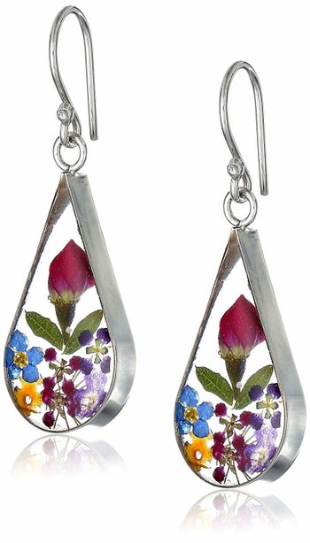 silver teardrop shaped earrings with clear center with colorful pressed flowers