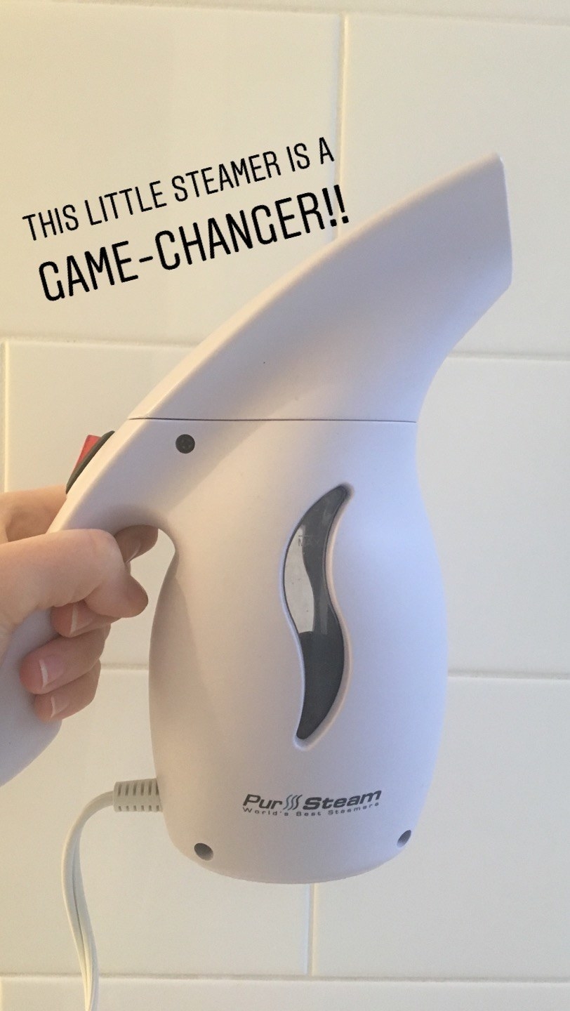 A hand holding the small steamer with text &quot;this is a game changer&quot;