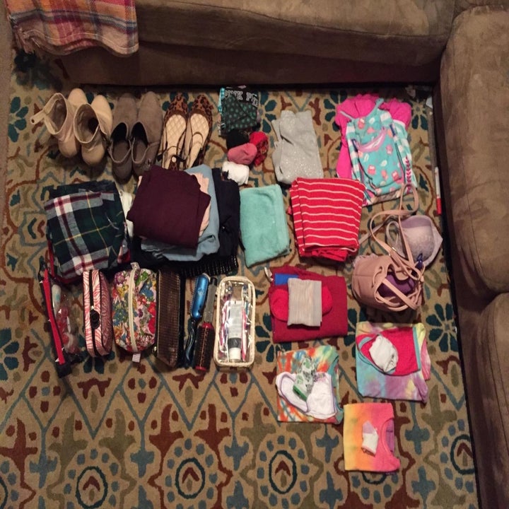 A reviewer's stacks of clothes and shows that need packing