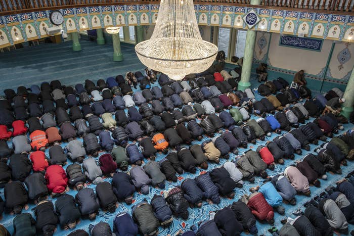 Men pray at the Suleymaniye Mosque in East London