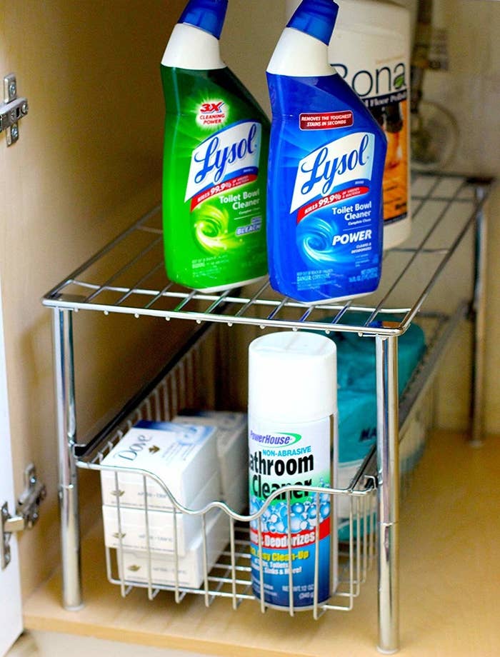 The two-tiered shelf, which can hold several bottles of cleaner, bars of soap, and toilet paper with room to spare