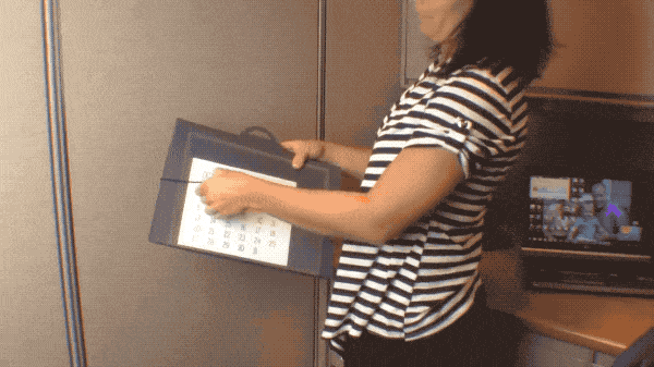 a moving gif of someone unfurling the cascading wall organizer
