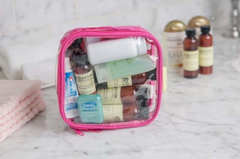 clear bag with toiletries inside