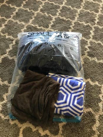reviewer's clothing items folded and not in bag