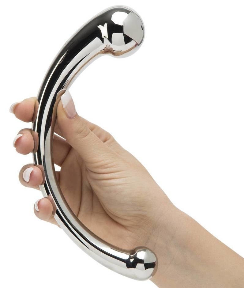 Hand holds curved silver dildo