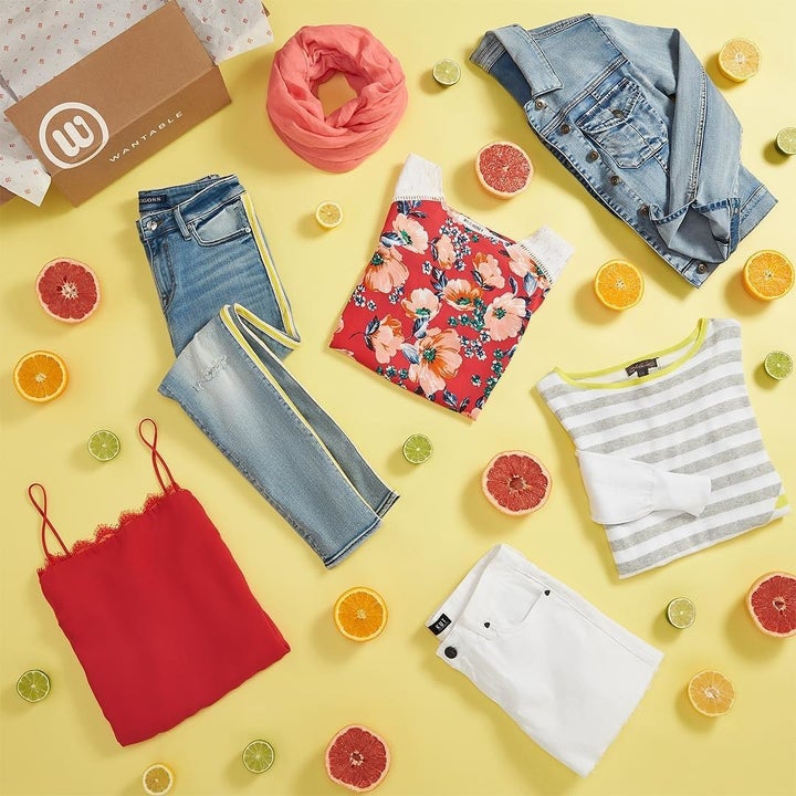 wantable style box surrounded by 2 pairs of jeans, a denim jacket, two tees, and a tank