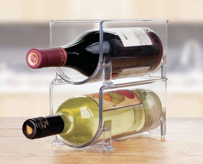 two clear acrylic stacked racks with wine in them