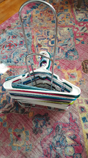 Same reviewer's picture of the hangers now neatly piled on the stacker 