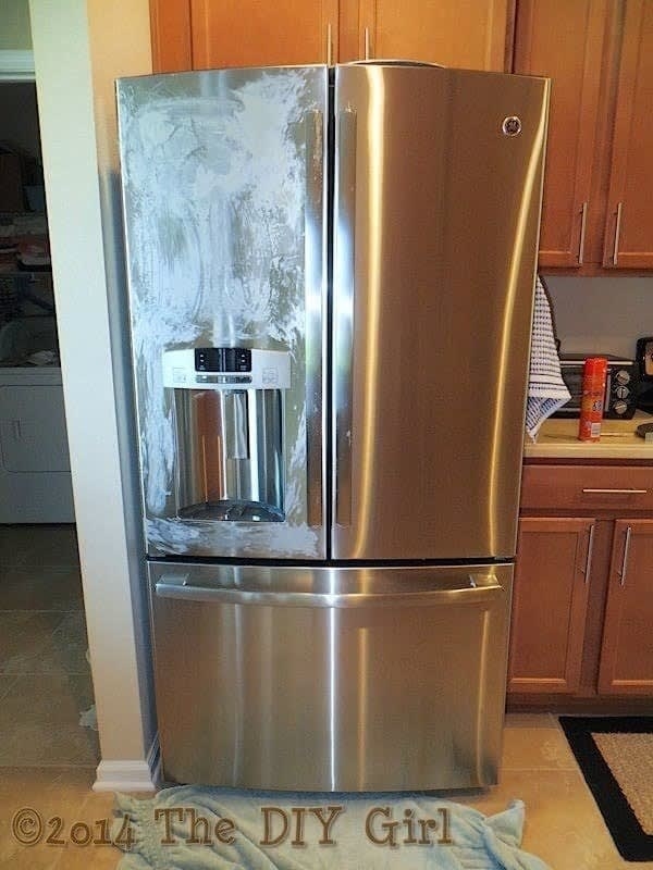 blogger&#x27;s stainless steel fridge; one door covered in dried pledge, the other door polished and shiny