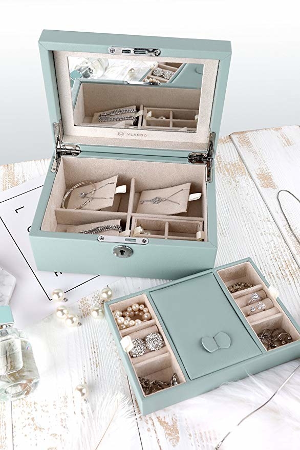 jewelry box styled on table with it opened up showing different compartments