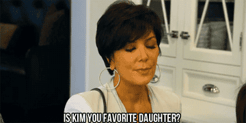 gif of Kris Kardashian looking down and text that says &quot;Is Kim your favorite daughter&quot;