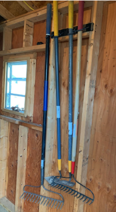 the same garage organized neartly with the steel hooks