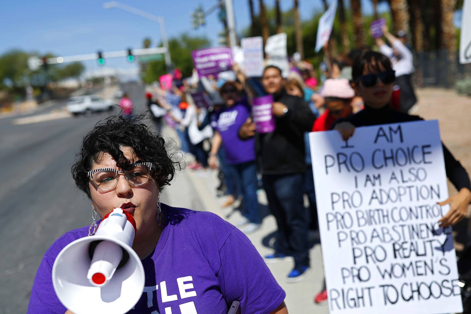 Karina Provost leads a chant during a rally in Las Vegas.