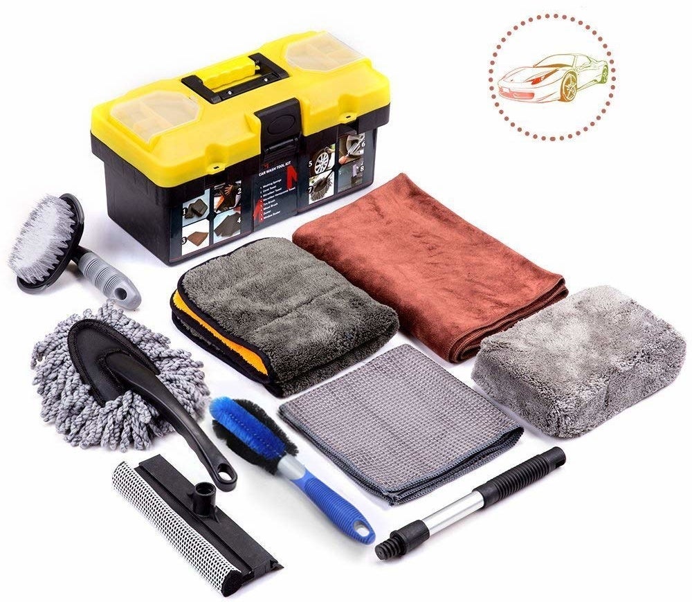 a car washing kit with scrubbing brushes and cloths and sponges