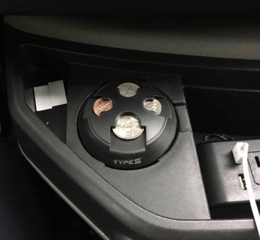 Reviewer image of coin organizer in cup holder holding different change