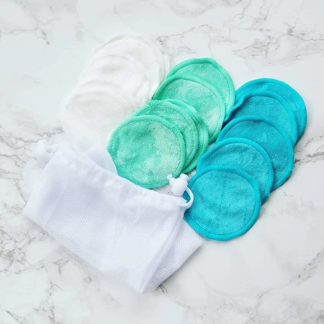 small round towels in white, blue, and green