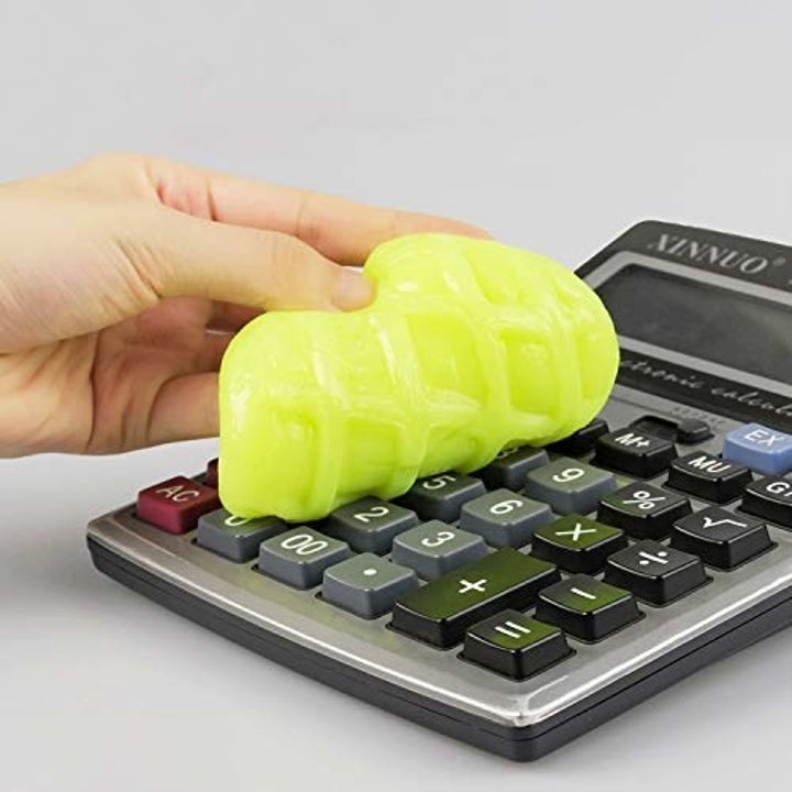 model uses slime to clean calculator 